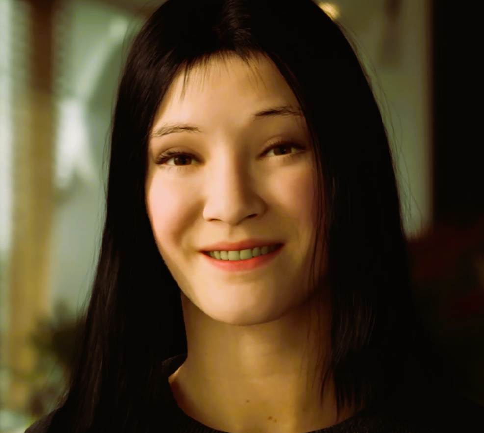 Sarah Wolf Bennett sorrindo em um ambiente iluminado.
